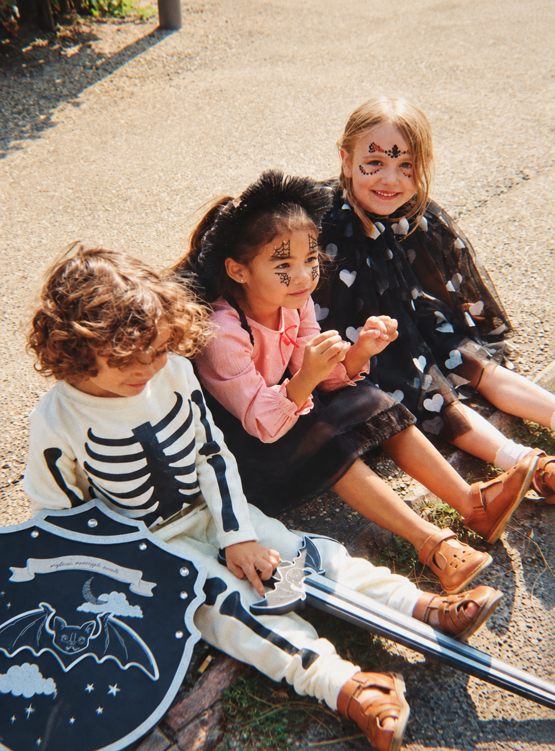 Children dressed for Halloween outdoors